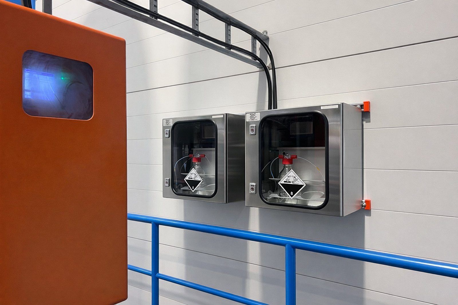 Two C14G2 samplers on a wall at a waste-to-energy plant